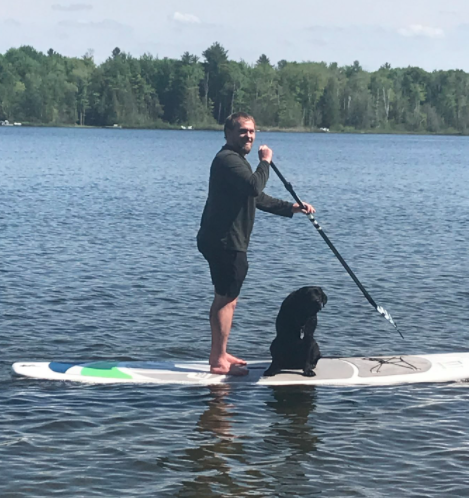 Corbett photo on lake with dog