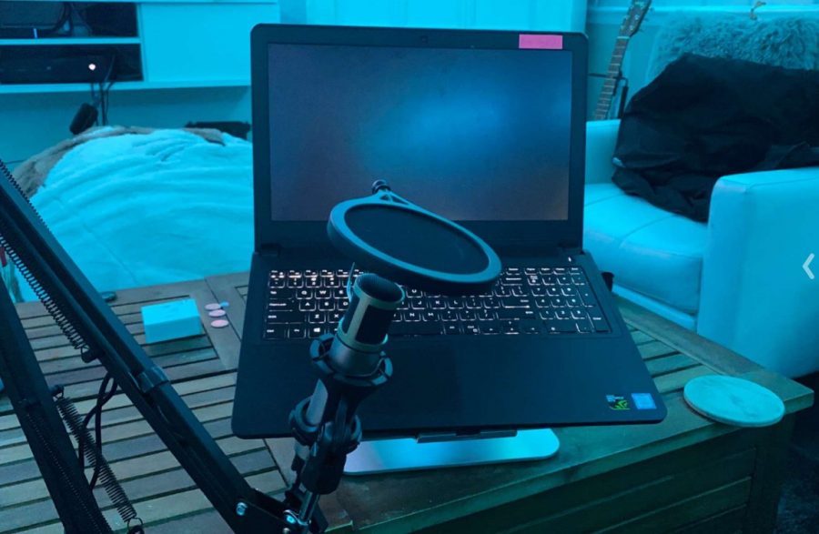laptop and microphone set up on a desk at the beginning of the schoolday