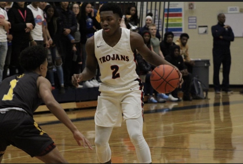 Marcus Wourman dribbling the basketball up the court