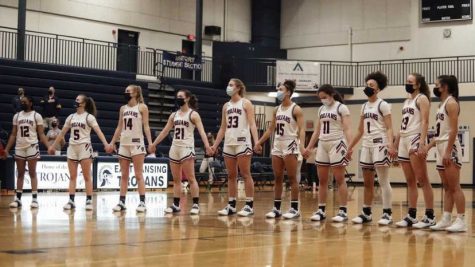 The varsity team stands before their game. 