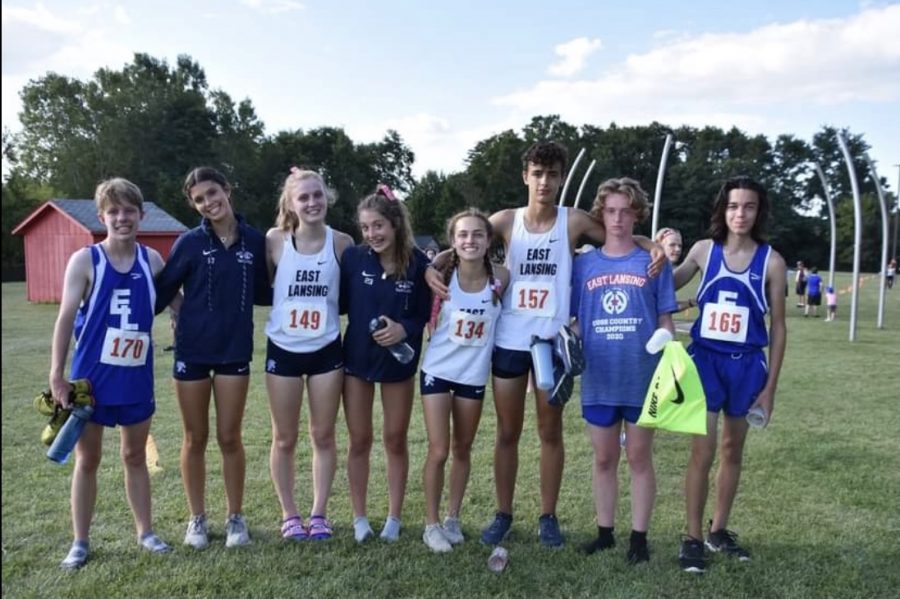 David Fort (11), Grace Rose (11), Barbara Stout (11), Esther Waller (12), Anna Delgado (11), Eden Lampi (10), Sean Flemming (12), and Eli Burch (10) pose for a picture at the Saranac Invitational September 2nd.

Photo Credit: Regina Stout
