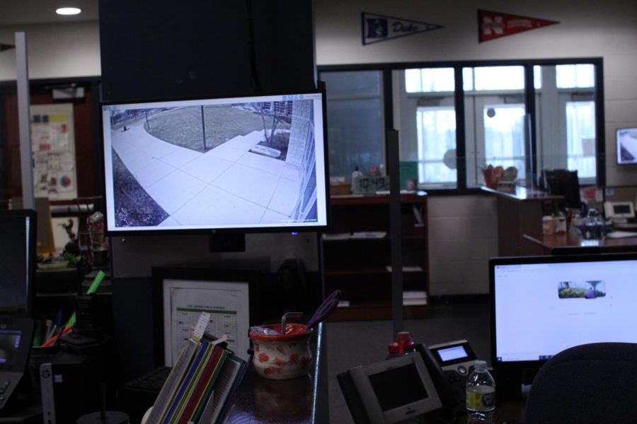 A+monitor+showing+a+live+feed+of+the+main+door+sits+next+to+secretary%2C+Nikie+Tapors+desk.+She+uses+it+to+check+peoples+credentials+before+letting+them+enter+the+school.