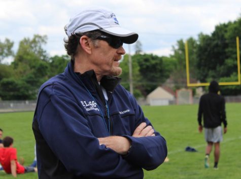Watching over his athletes during a track practice on May 23, Patrick Murray observes as the runners begin a set. Murray has coached the team for several years now, and has taught at ELHS for decades.