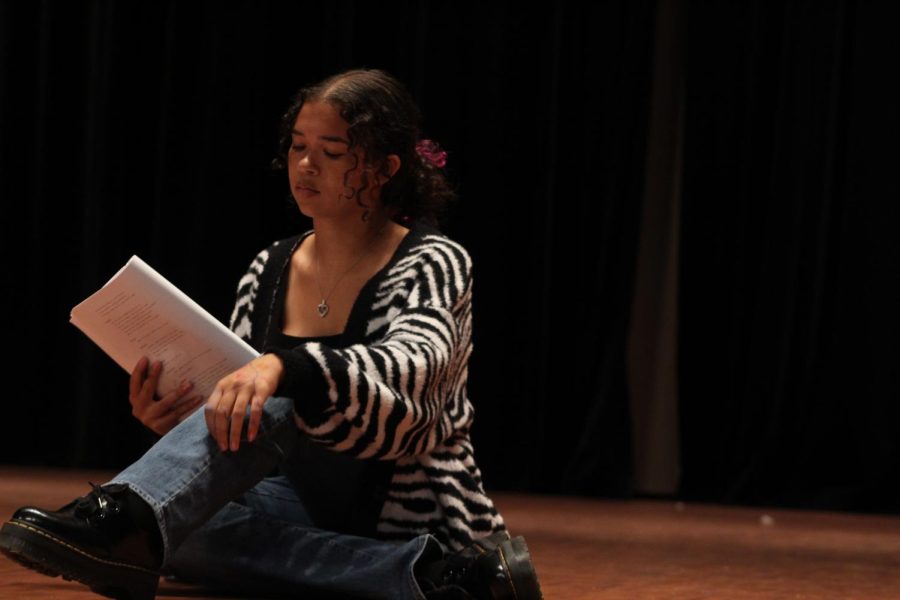 Sitting on stage in the auditorium on Sept. 23, Zoe Yingling reviews her lines for the upcoming play; Midsummers Night Dream.