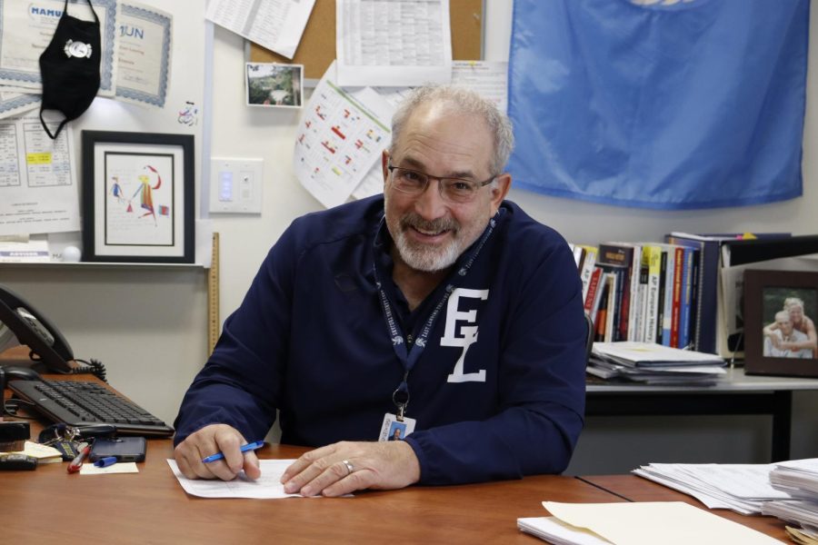 Grading papers on Friday, Nov. 18, history teacher Mark Pontoni sits at his desk on Friday.