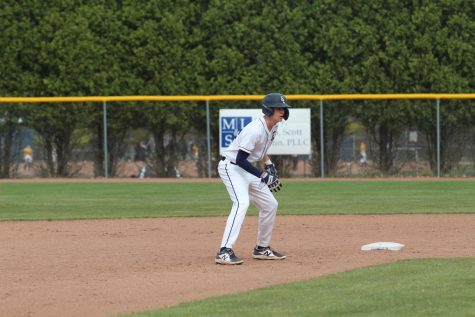 Paul VanDam (12) takes a lead after getting a double against Haslett on April 11.