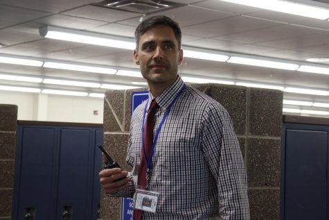 Standing in the hallway by the office on April 18, Spanish teacher and in-term assistant principal Jeff Lampi looks towards ELHSs main entrance.