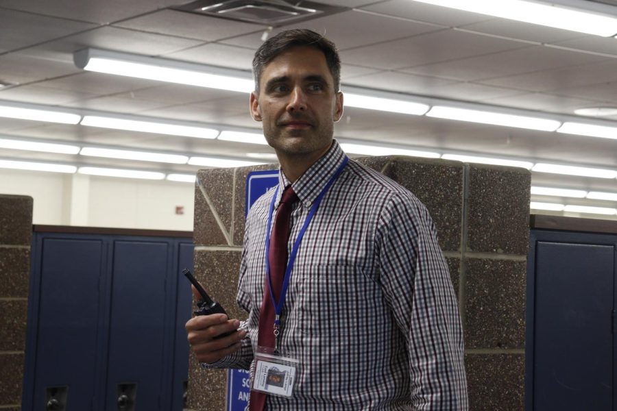 Standing in the hallway by the office on April 18, Spanish teacher and in-term assistant principal Jeff Lampi looks towards ELHSs main entrance.