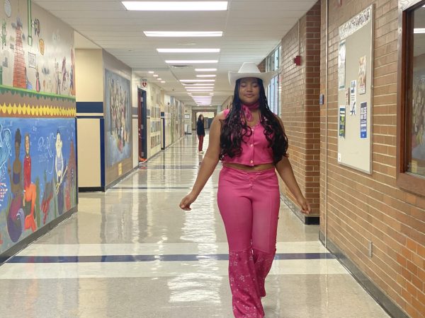 Cowgirl hat on, Nala Noel strolls down the hallways on Sept. 27 demonstrating her school spirit. The spirit week theme for the day was Barbie vs. Ken, and she was imitating the cowgirl Barbie outfit from the “Barbie” movie.

