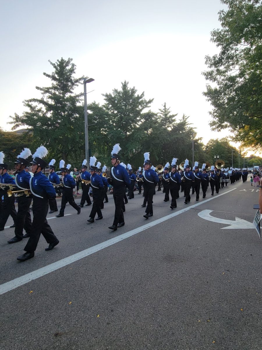 Instruments in hand, the ELHS marching band marches down Grand River Avenue on Sept. 22 as part of the MSU homecoming parade. As tradition, the over 100 marching band students participated in the parade, which was themed “Welcome Home Spartans.” 
