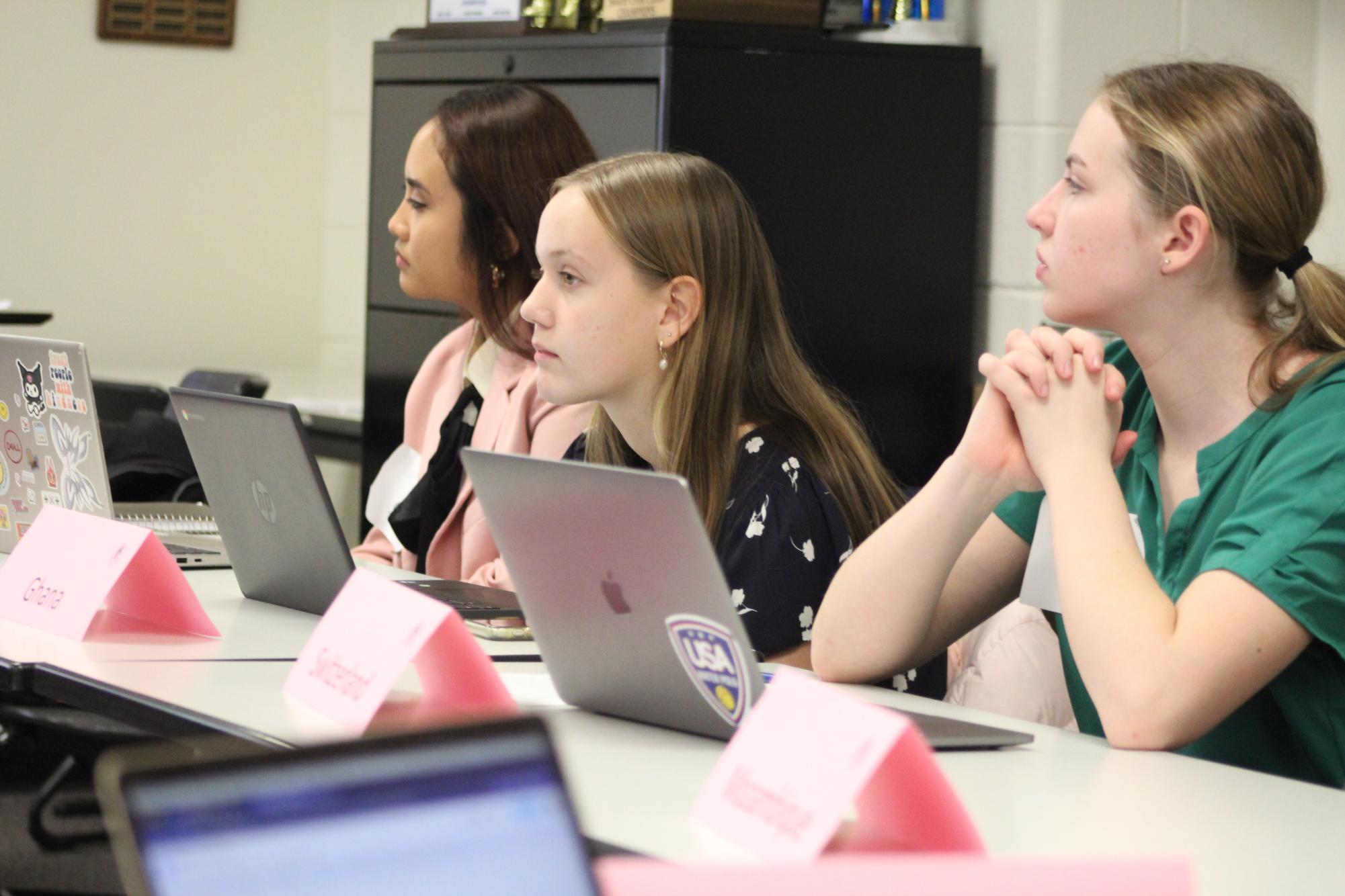
During the Model UN conference Oct. 28, Elizabeth Ahlin (9) and Sophia Fickies (11) listen intently to the conversation taking place.