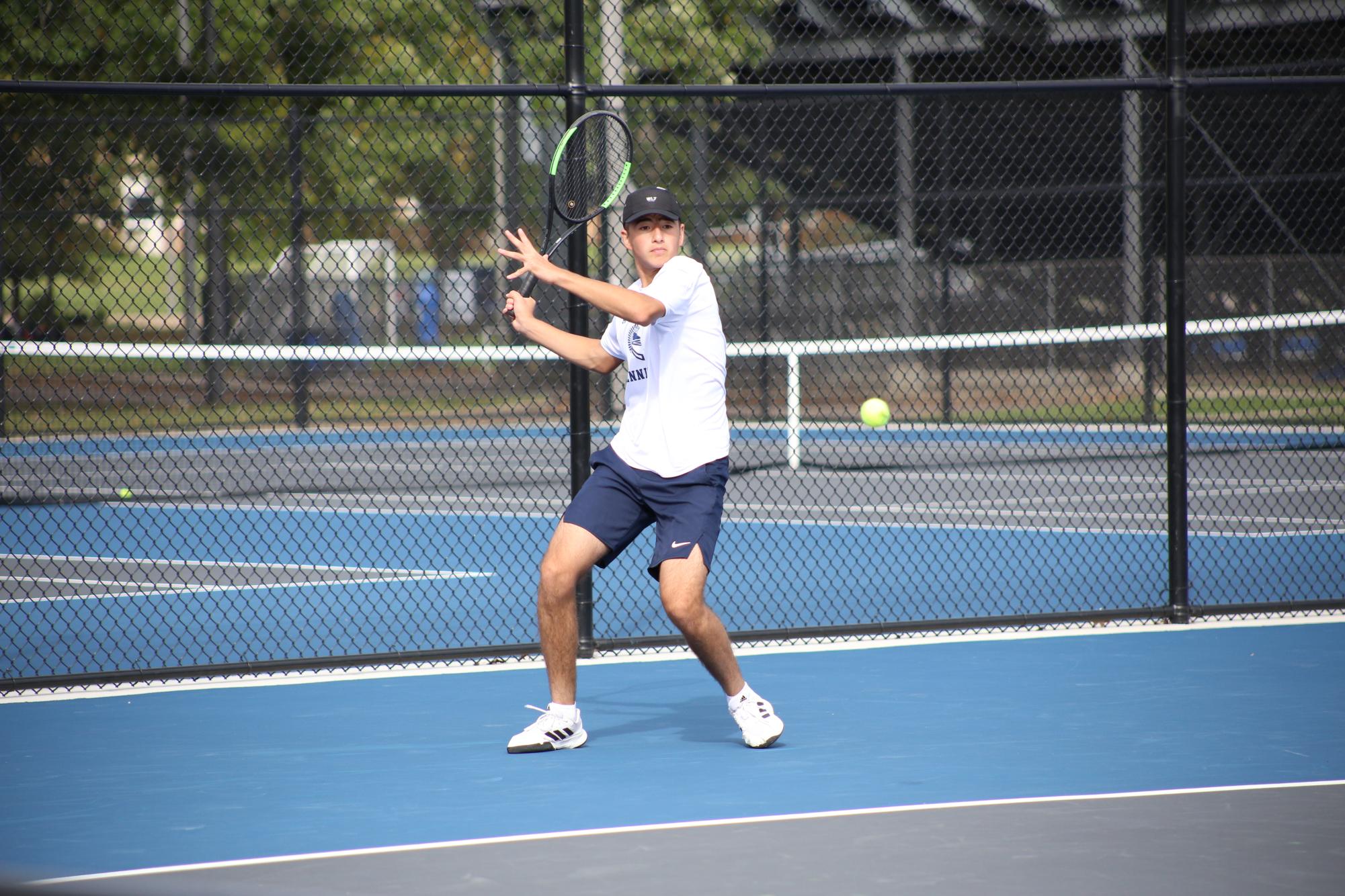 Getting ready to return a serve, Ismoil rears his racket back in preparation on Oct. 6.