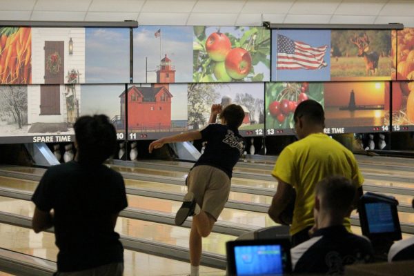During a scrimmage at Sparetime in East Lansing on Nov. 28, Joseph Monterosso (11) rolls the ball down the lane hoping for a strike. The team officially started competition on Dec. 13. 
