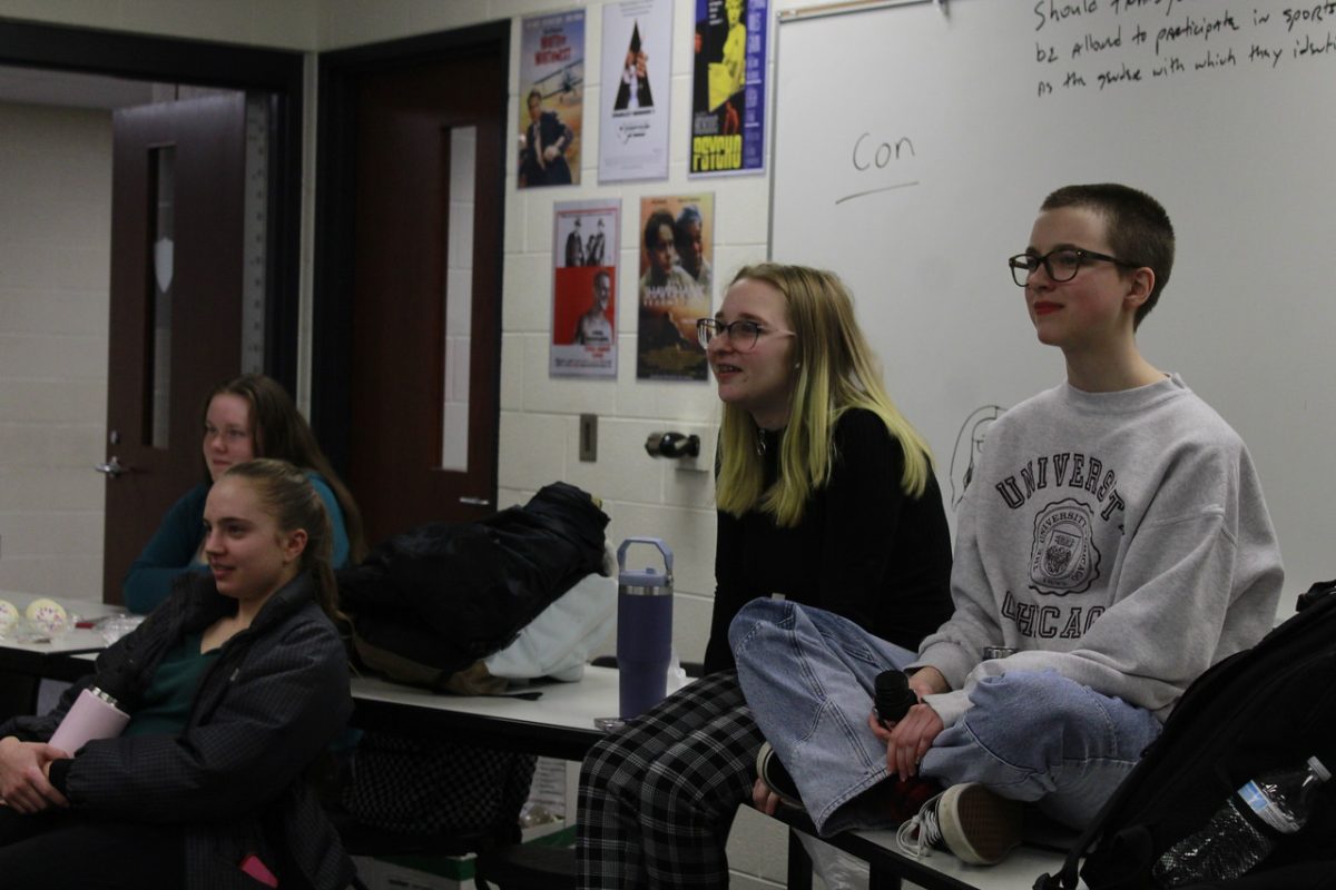 Matea Smith(left), Eryin Seigel, Sam Tuinstra, Kelly Maier, and Alex Paddock(right), all juniors listen to the story being told in conversation club on Nov 27.