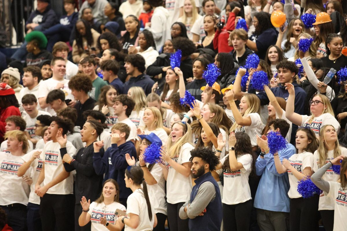 The ELHS student section cheers on the boys varsity basketball team as they play against Waverly in the main gym on Jan. 11.