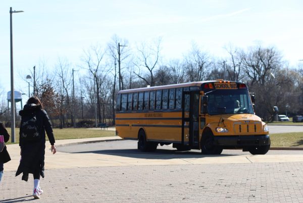 Patience Brock (11)  walks to the Wilson Talent Center school bus on March 12. 