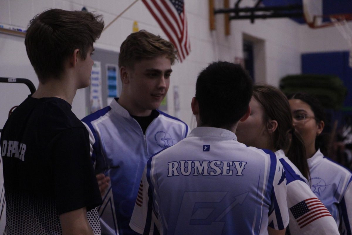 In the moments before the competition archery teammates, Matt Rumsey (10), Jack Draper (11), Owen Snook (11), Emma Roberts (11) and Olivia Simmons(10) come together to discuss the game plan on Feb. 26.
