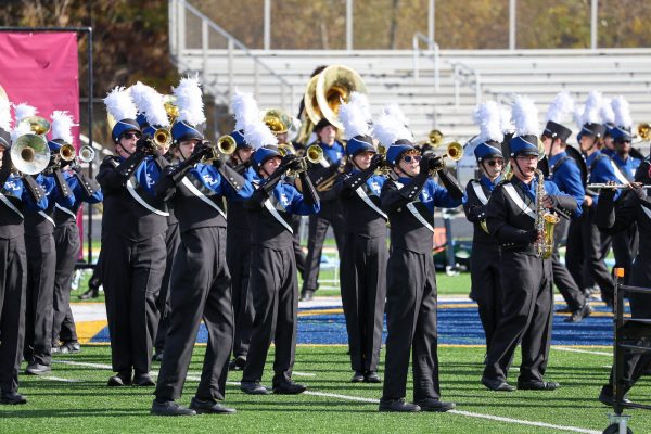 Performing their halftime show, members of the ELHS marching band compete in the MCBA prelims at DeWitt High School on Oct. 26. The band placed eighth of 11 bands, which determined their performance time for Ford Field. Photo by Adrianne McAdoo