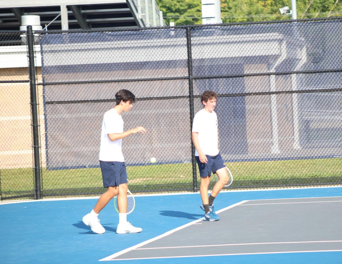 Jonny Kalt(12) and Sacha Karp (12) prepare for point on Sacha's serve during the East Lansingvs Okemos match on 9/11. 