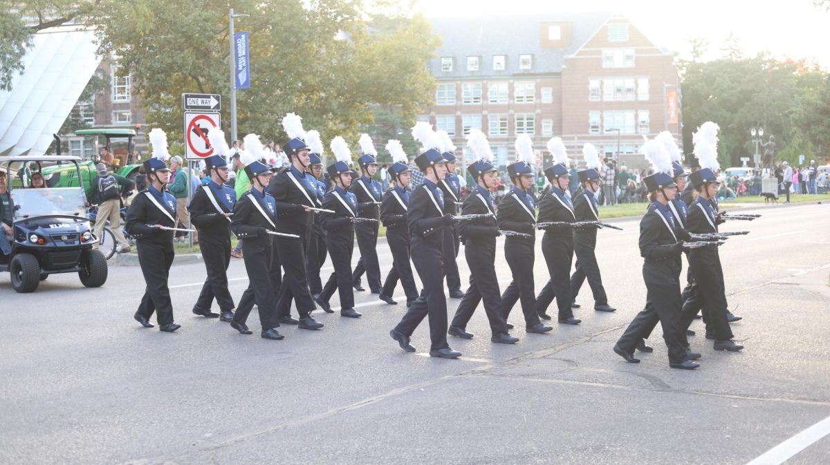 East Lansing marching band marches in the Michigan State University homecoming parade down Grand River Ave on Oct. 18 2024.