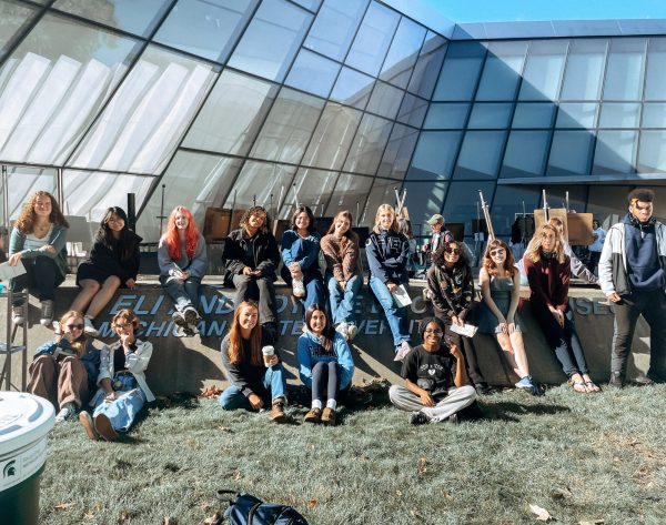 AP art teacher Elise Millard poses with her class in front of the Eli Broad Art Museum on Oct. 2 2024.