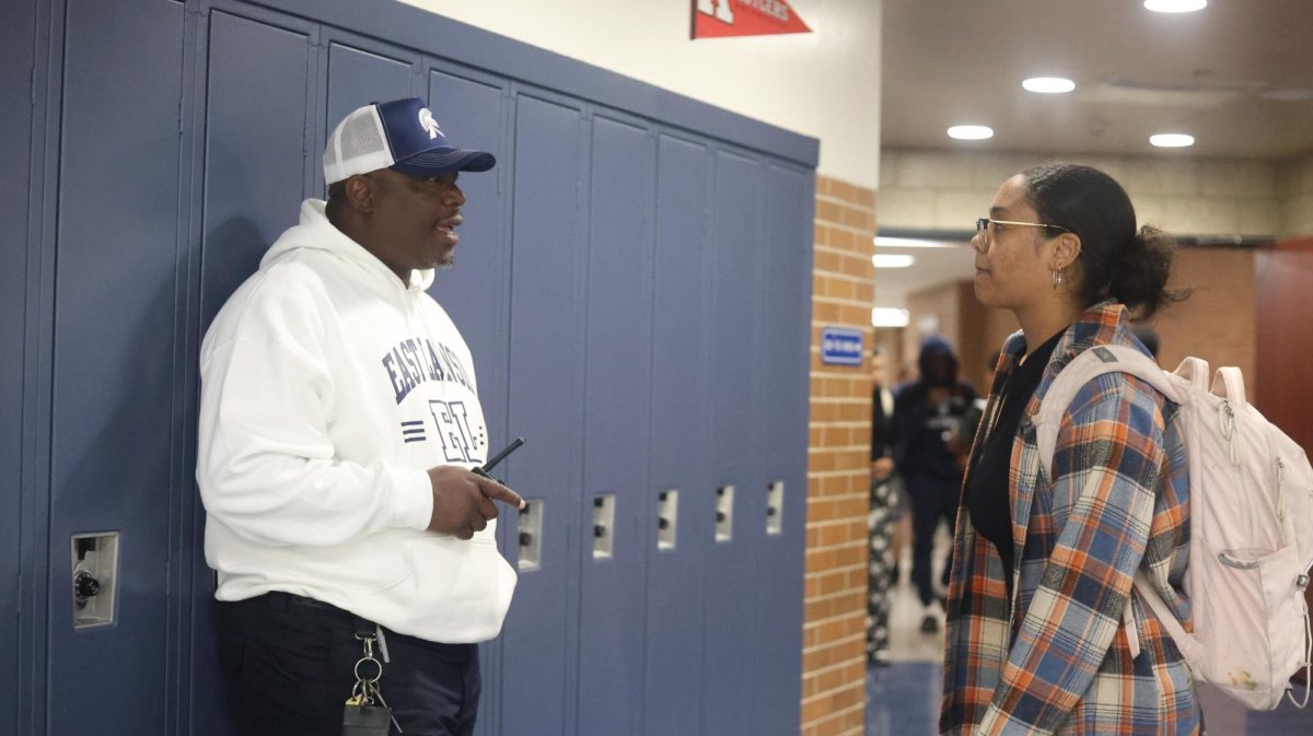 As late lunch started, Lead Safety Monitor Ronshon Fisher spoke with Ava Hayes (12) checking in on school life and grades on Sept. 25 outside of the commons. Fisher is one of the five new safety team members hired at the high school this year.