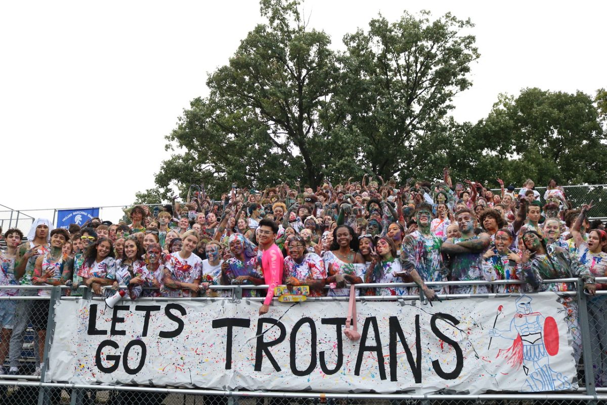 Painted out student section, at the home boys varsity football game against Dewitt on Sep 27, poses for a picture during the first quarter.