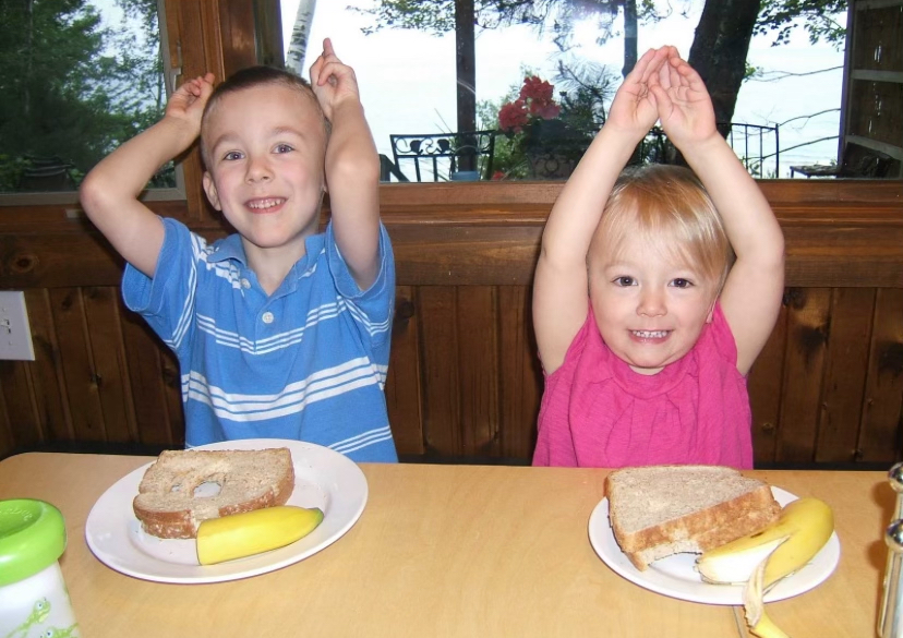 During lunch, Kate Aupperlee (11) and Andrew Aupperlee made fun poses for the camera while on  vacation in the summer of 2010. While on their trip, the Aupperlee family stayed at a rented cottage in Pentwater directly on Lake Michigan.