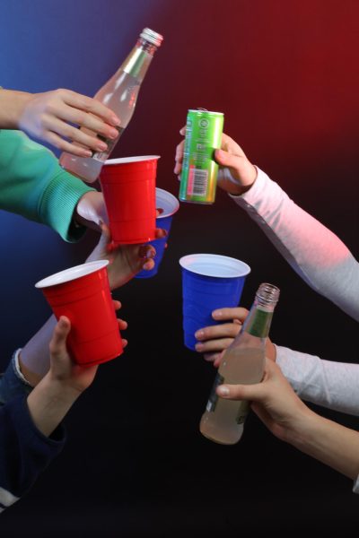 Imitating a party scene, students at ELHS showcase beverage bottles and cups. Such objects are common items seen when entering a function. 