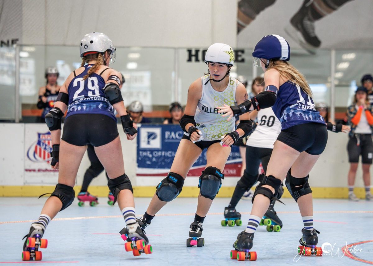 Izzy Antaya (11) competes in a home roller derby game. Antaya is a jammer for the Kalamazoo Killer Beez. Courtesy photo.