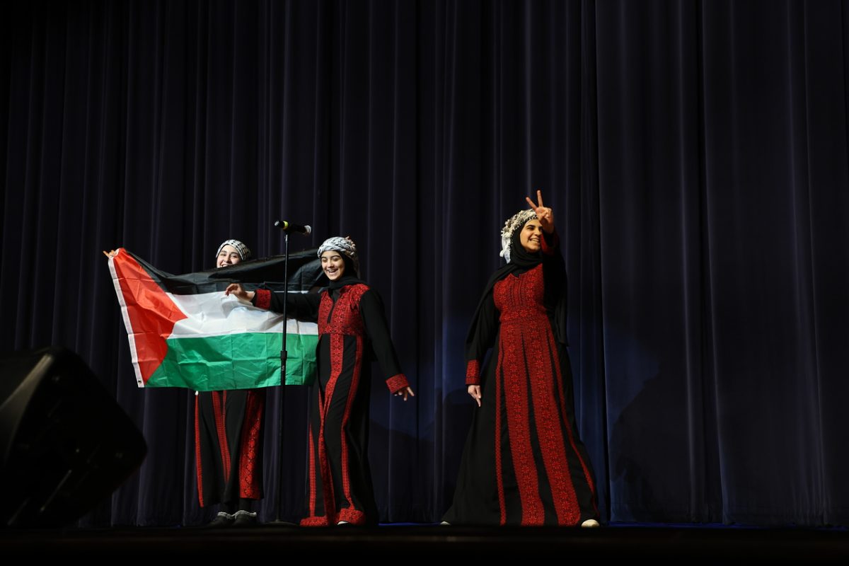 Dalia AbedAlqadi (10) and Razan Mady (10) perform an untitled poem written about Palestine by paraprofessional, Somer Ramadan. 