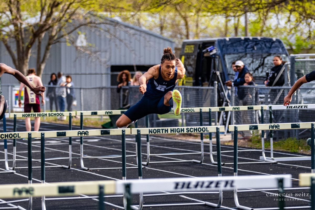 Kamden Bigham-Tsai (11) leaps over a hurdle in the conference track meet at North High School in Des Moines Iowa on April 19, 2024. Courtesy Photo

