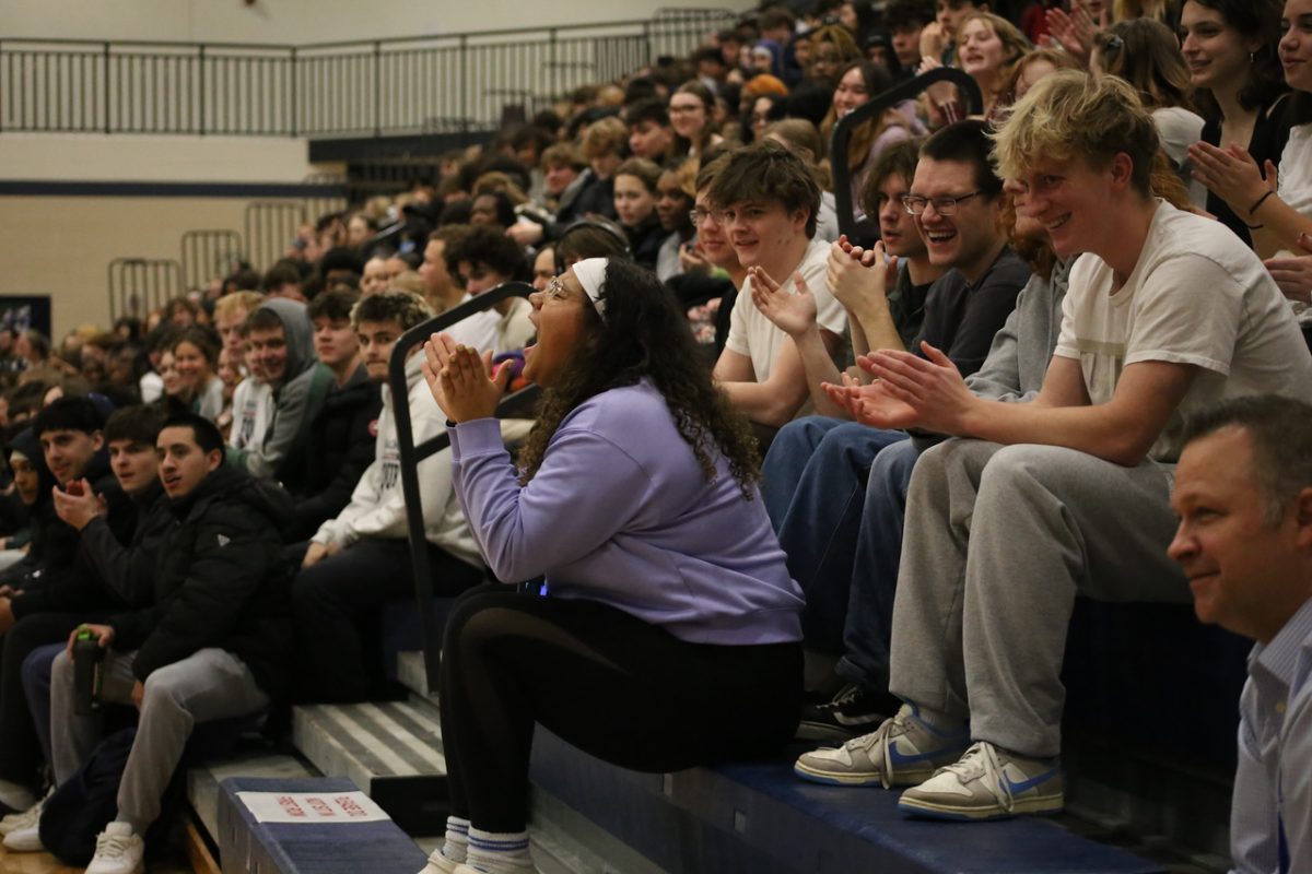 Alayna Nixon (12) screams and cheers during the pep assembly. 