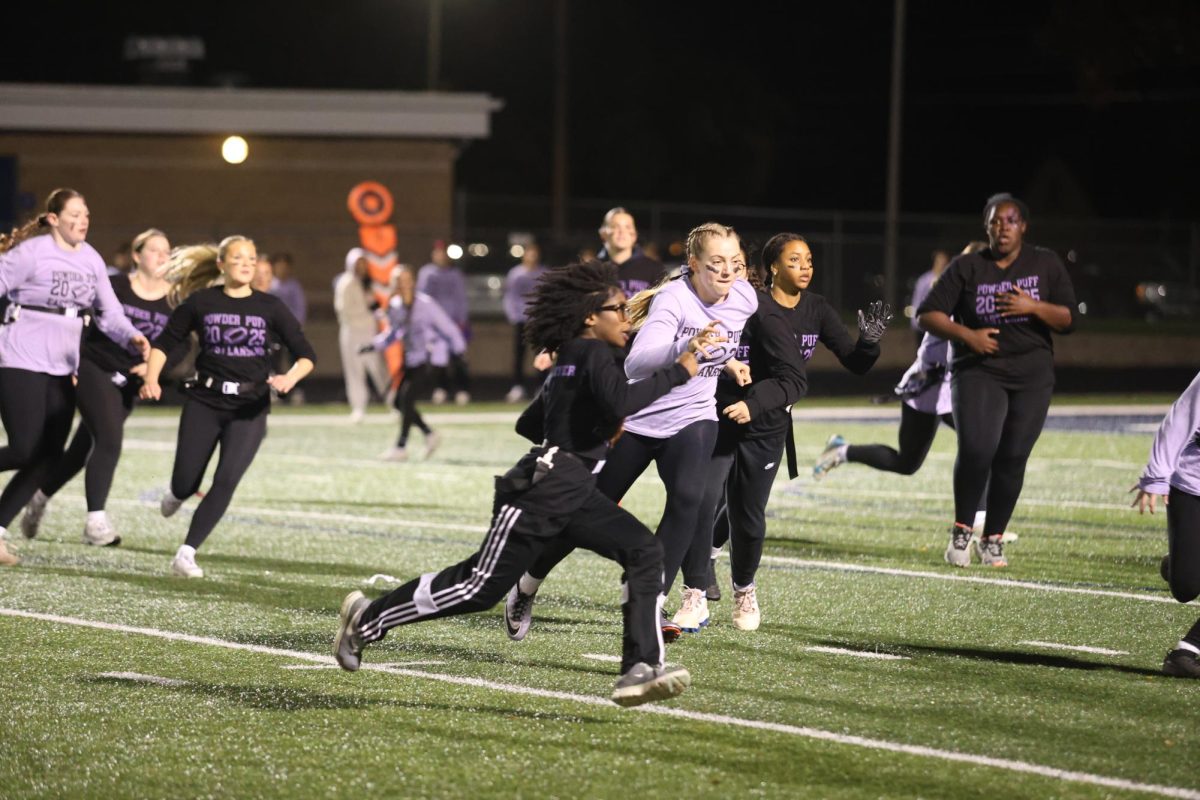 Dashing across the field, Favour Nwobu (12) breaks for a touchdown. The event, a fundrasier ended up making over $4000 for the Karmanos Cancer Center. 