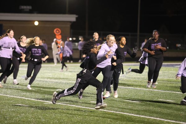 Dashing across the field, Favour Nwobu (12) breaks for a touchdown. The event, a fundrasier ended up making over $4000 for the Karmanos Cancer Center.