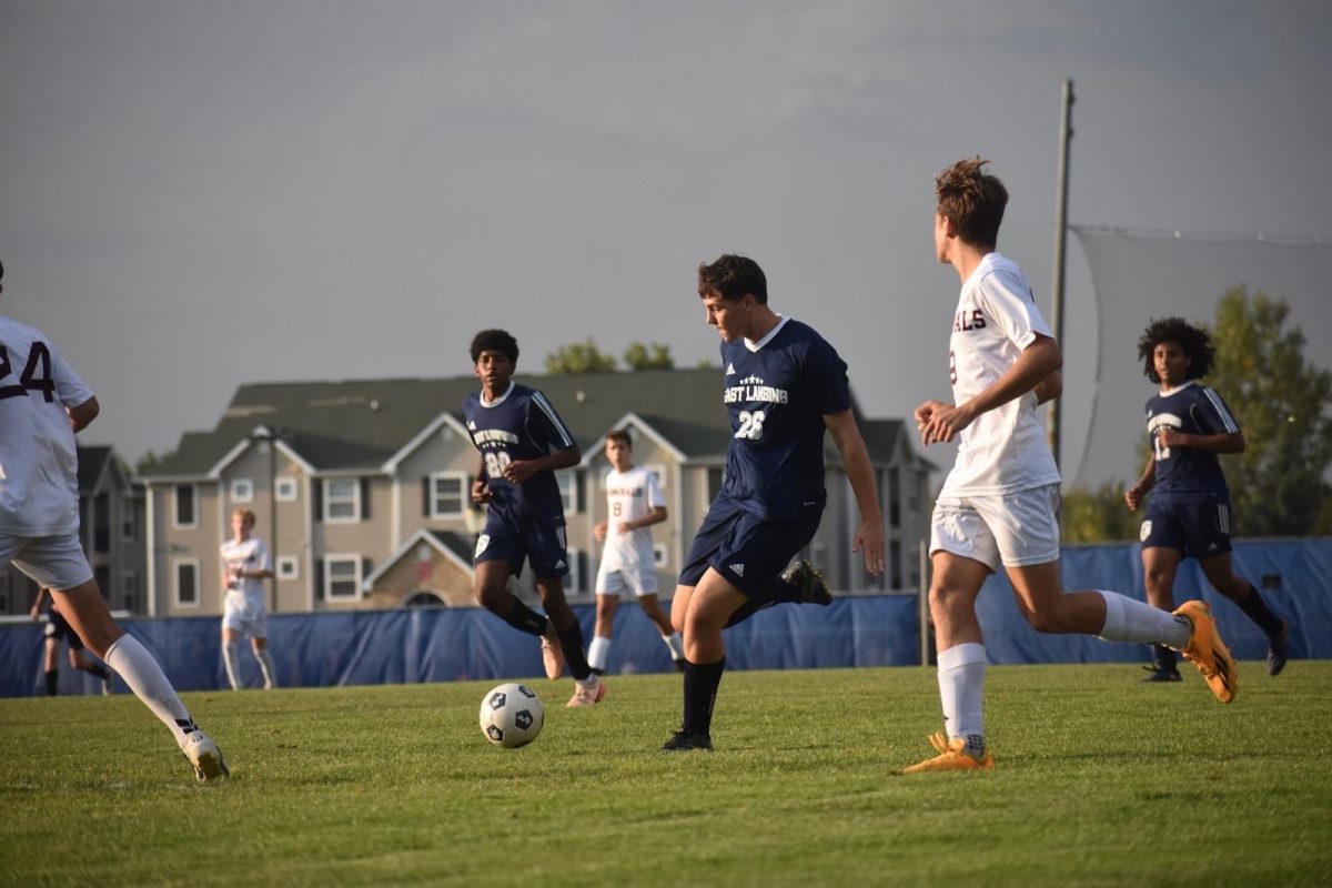 Passing the ball to his teammate, Nicolas Cattani (10) starts off his soccer season with an invitational against Portage Northern on Aug. 16. This is his first game on a new team, as he is a transfer from Brazil.