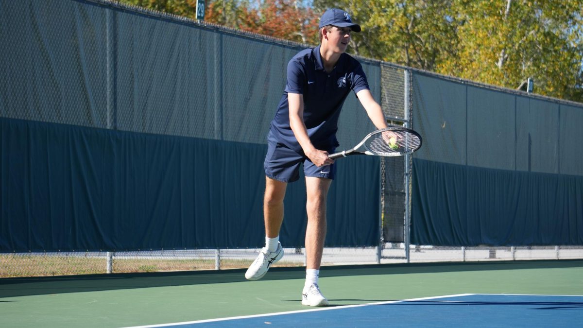 Preparing to serve, Bodhi Alwin (12) scans the other side of the tennis court. He made it
all the way to the semi-finals in the regional competition with his doubles partner, Donald
Harley (11), where they competed against Midland Dow.