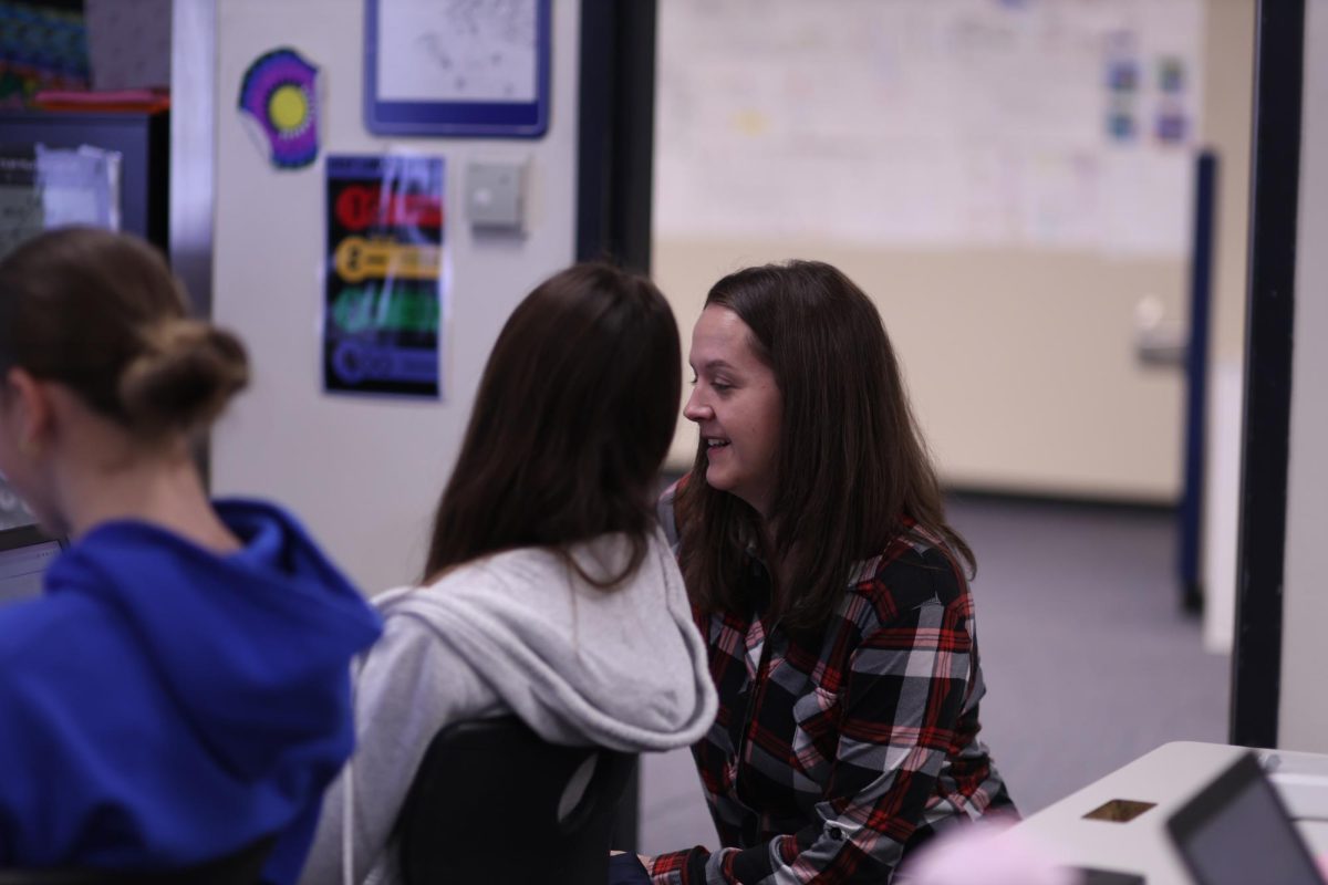 Math teacher Jodi Wheeler helps a student during her second hour geometry class on Oct. 30. Wheeler recently returned from maternity
leave and has slowly been returned to normalcy after her elongated maternity leave.