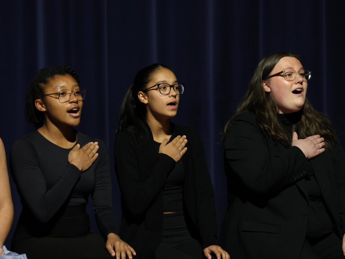 Performing at collage, Kiana Nelson (10), Victoria Chacon (10), and Haley Bovee sing "White Winter Hymnal" by Pentatonix. The EL Singers group had a total of three songs during the show.