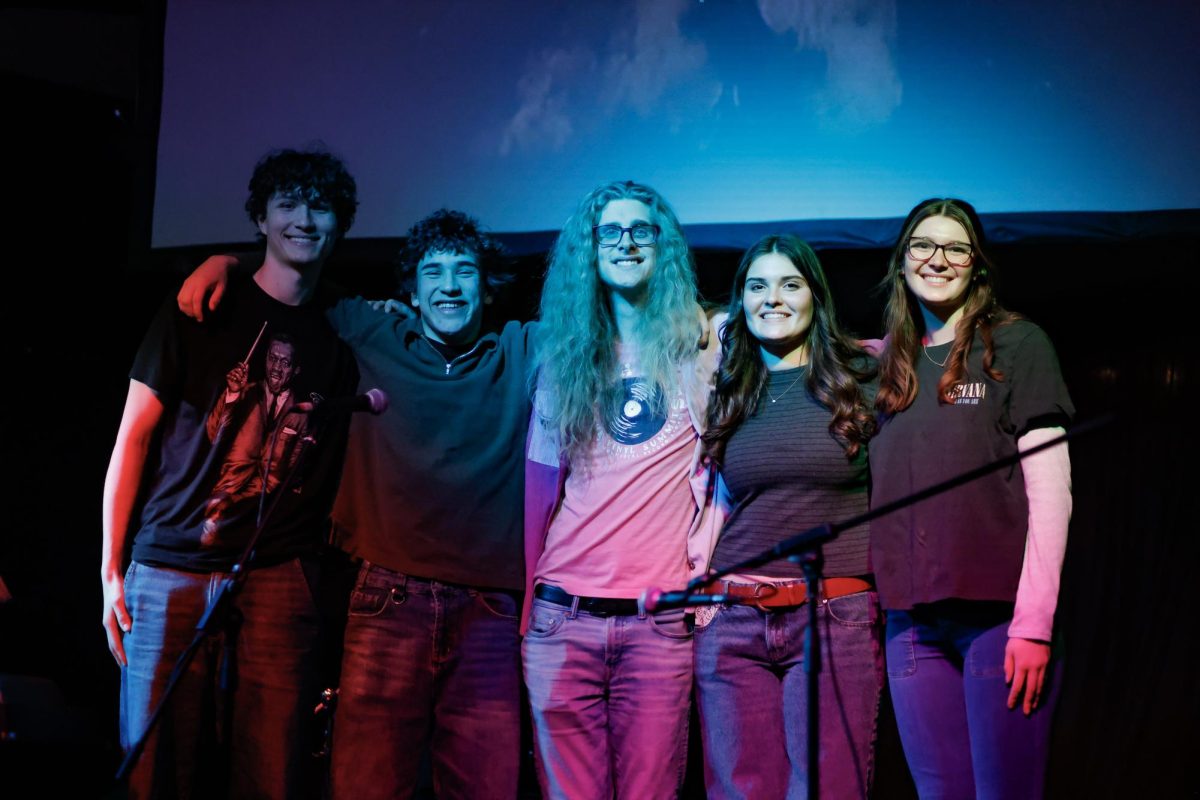 The members of the Livewire band, Casey Smith (12), Elijah Braiman (10), Liam VanDerHeide (12), Stella Alfredson (12) and Julia Valla (12), pose for a picture at the end of their gig at The Avenue on Jan 25. 