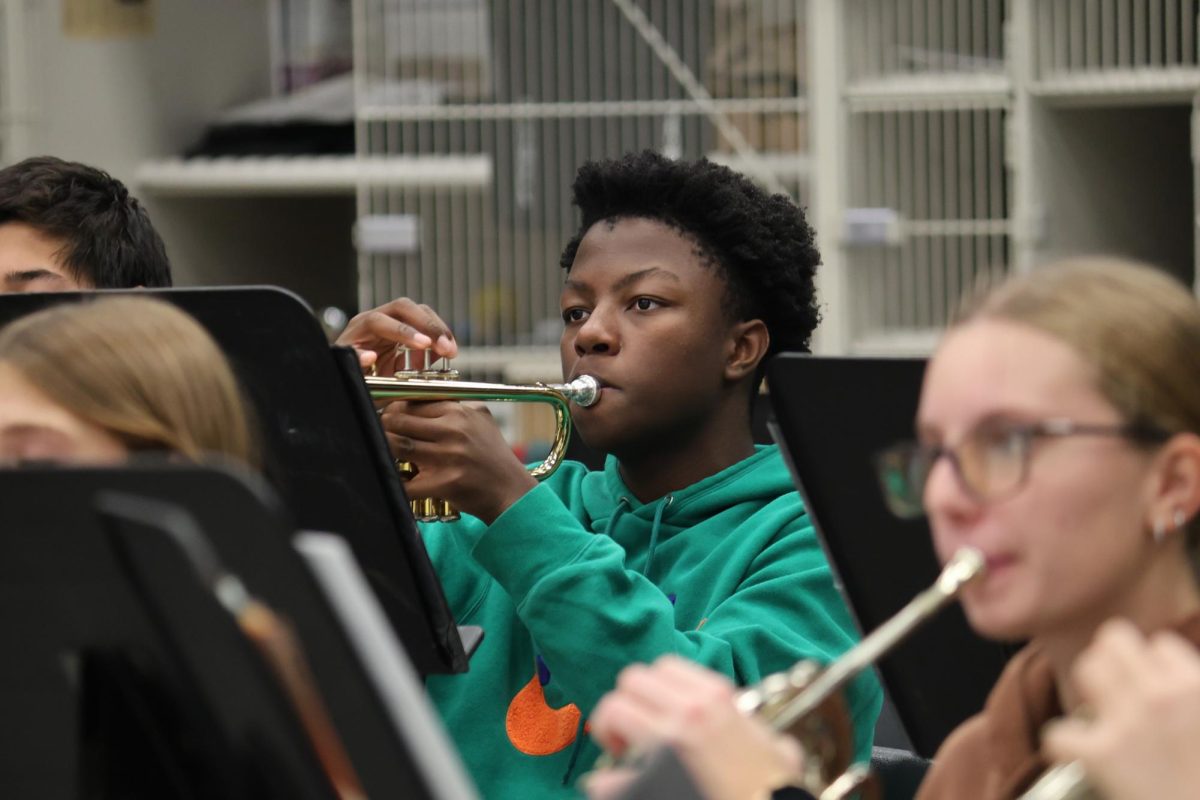 Focusing on his teacher, Justus Battle (9) plays during band class. In addition to being in Symphonic Band, Battle was a part of jazz band, auditioning on Nov. 2.