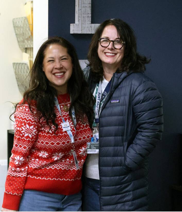 Posing for a picture, Catherine Schwartz and Maureen Ritchie take a break from working in the office. 