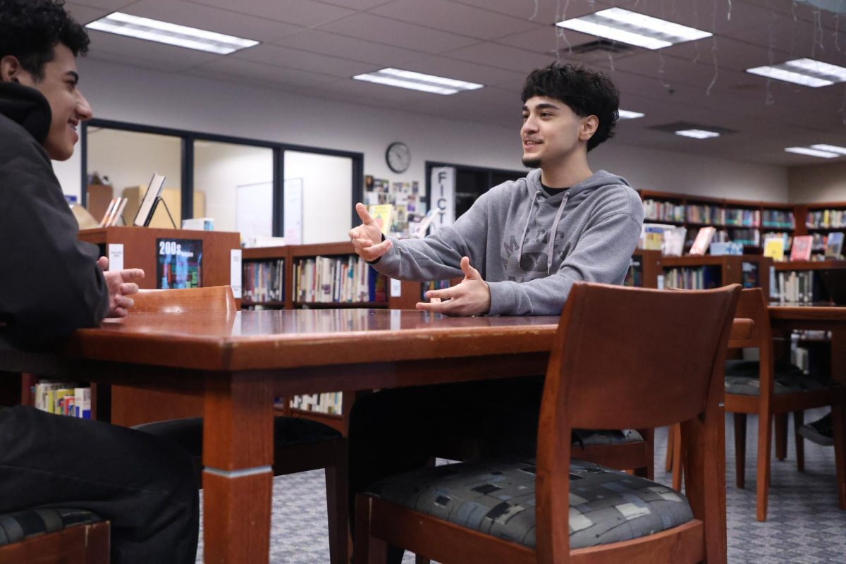 On Dec 12, Saad Almora (12) talks to Ghaith Albaaj (12). Almora learned Arabic at 6-years-old after moving to Iraq.