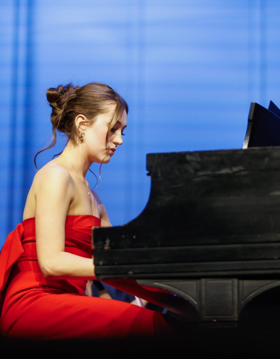 Clara Craig (12) plays piano on Senior Solo on Feb. 19. Craig has played since she was four and this event gave her the opportunity to play in front of all her peers.