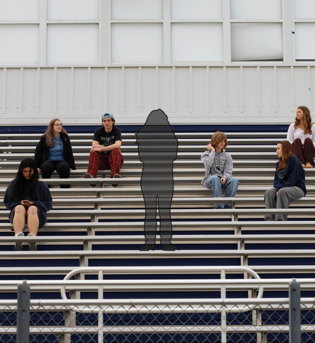 Several students sit in bleachers surrounding an invisible figure representing the isolation of having a chronic condition. 