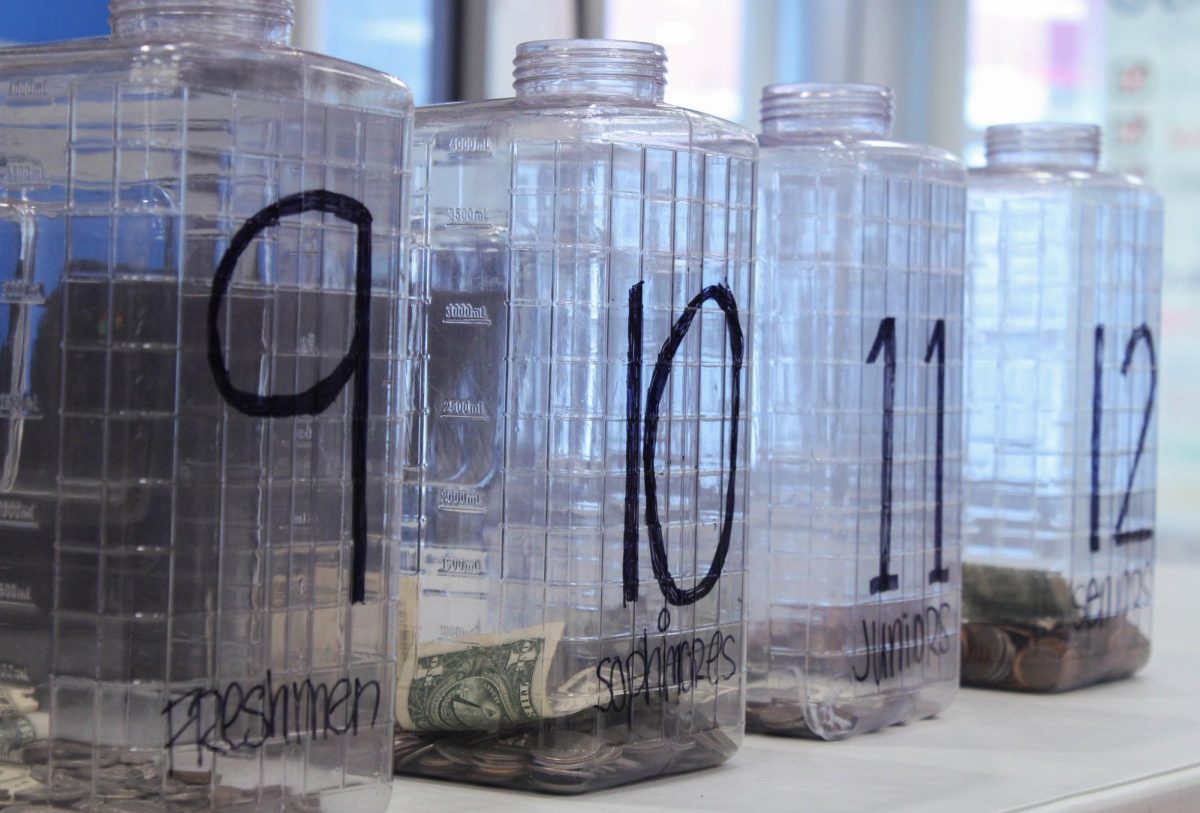Jars for the Penny Wars fundraiser sit outside the hub during both lunches on Feb 5. The fundraiser collected $128 dollars to be put toward the Women's Center of Lansing. 