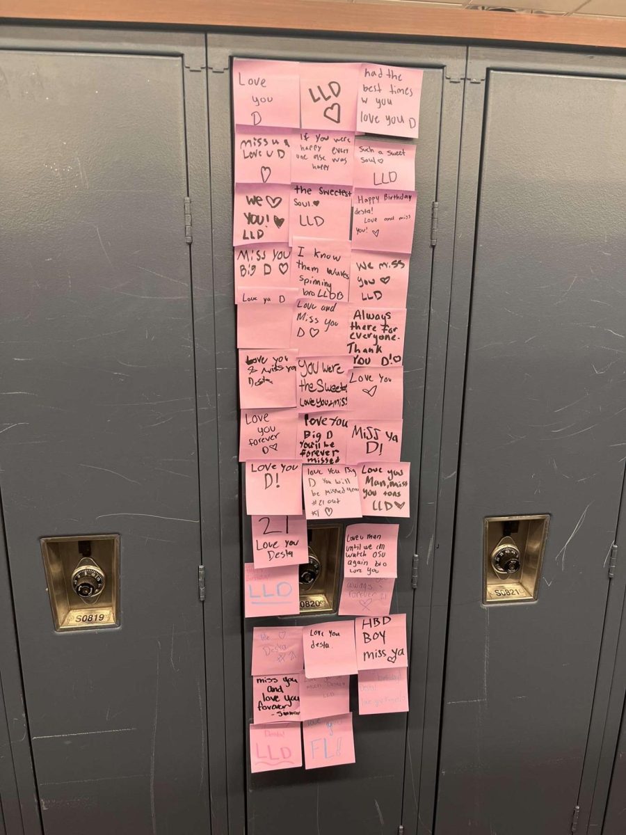 Covering his old locker, students fill Desta's locker with post-it notes. The display showed how deeply he was loved and remembered by his classmates.