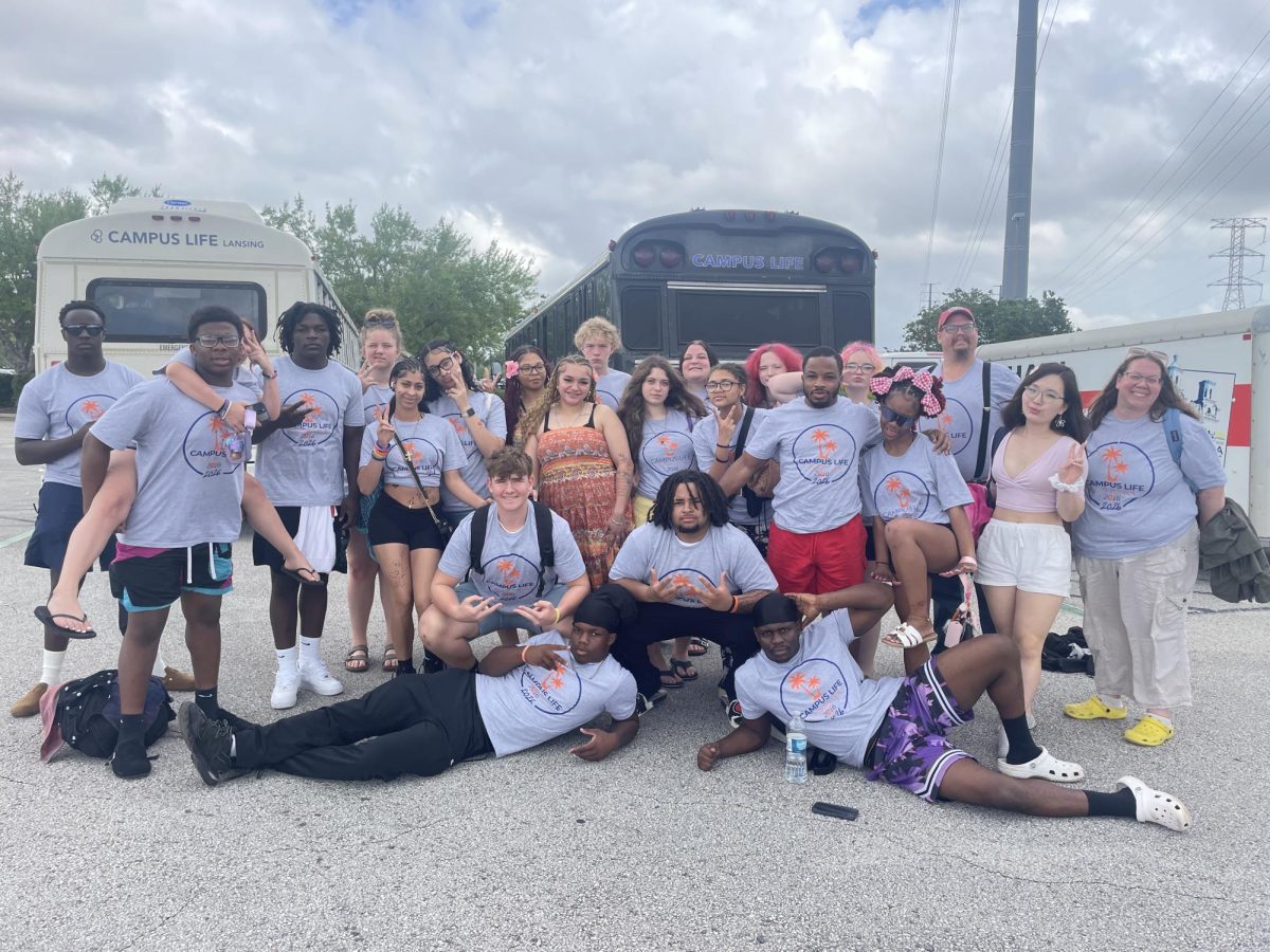 Posing for a picture, Karis Hayes fourth in from the left stands with fellow campers from Lake Aurora. Lake Aurora is a Christian camp that attended over spring break